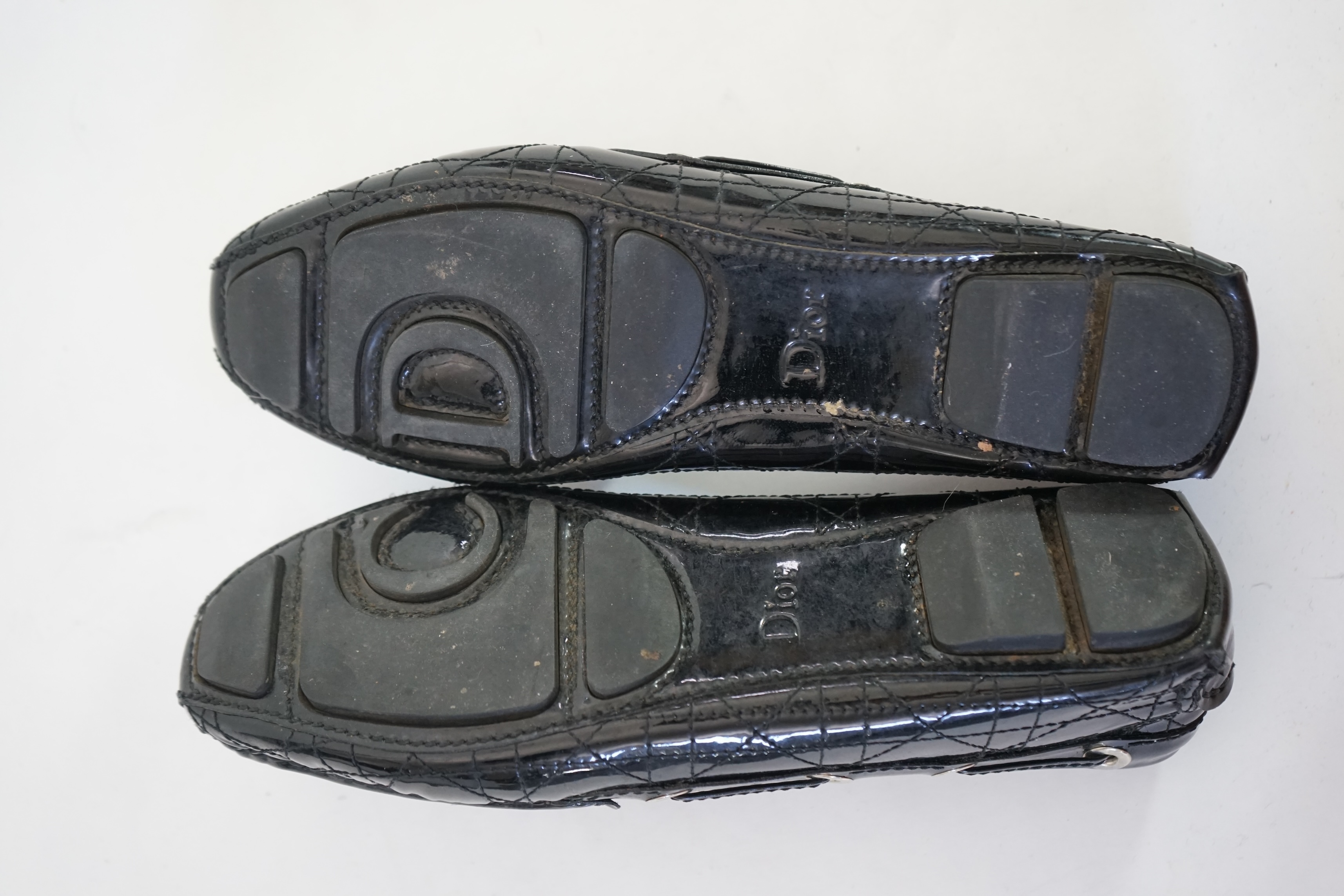 A pair of Christian Dior black patient leather lady's driving shoes with dustbag and in original box. Size 38.5. Proceeds to Happy Paws Puppy Rescue